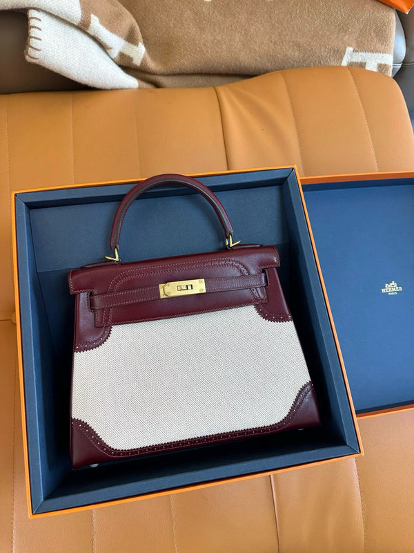 Hermes kelly 25 with red leather trim and a white canvas body